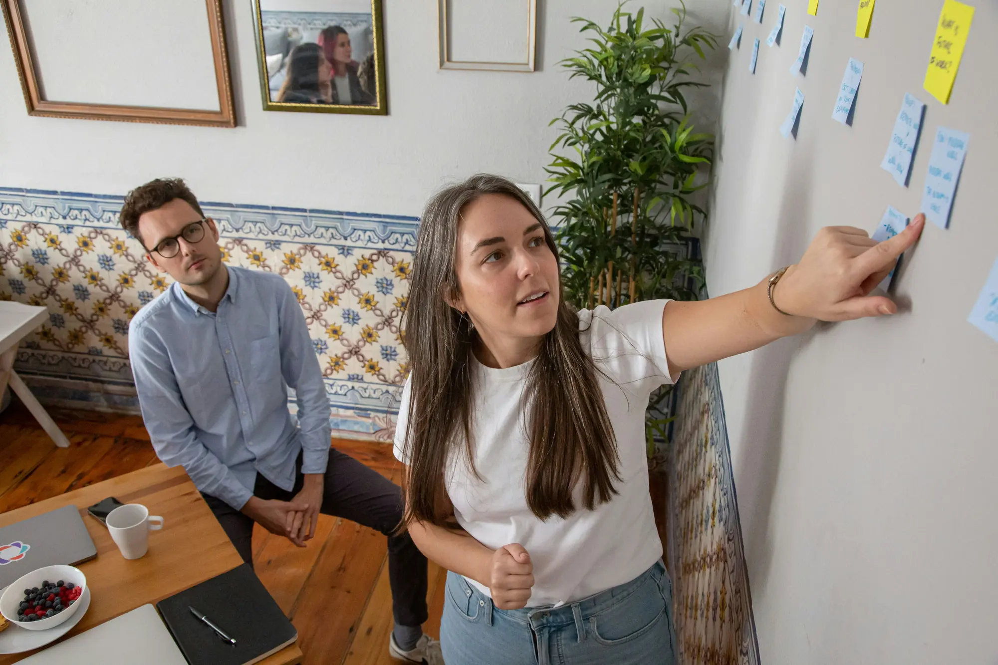 A small team planning on a wall of notes