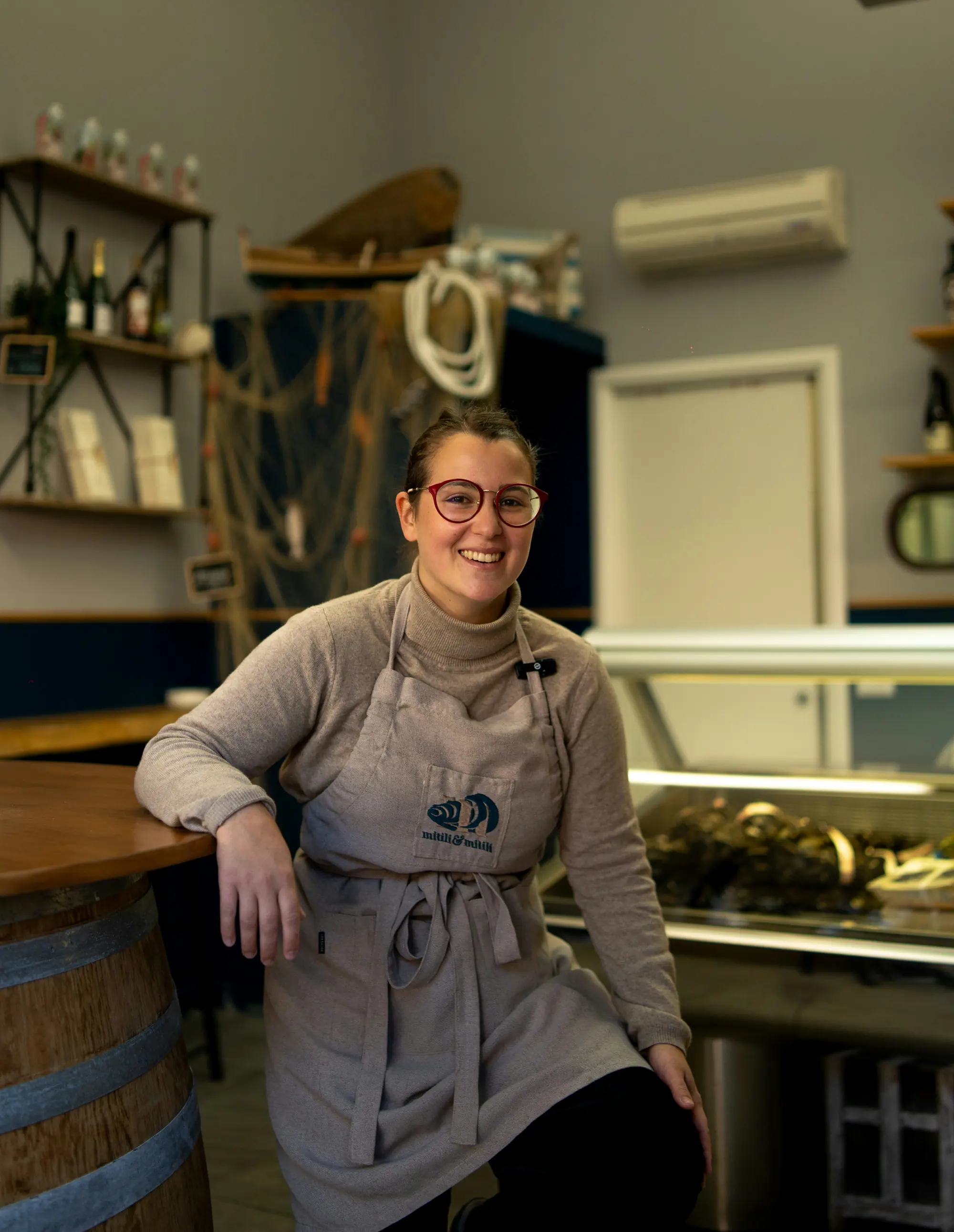 A shop owner at her counter