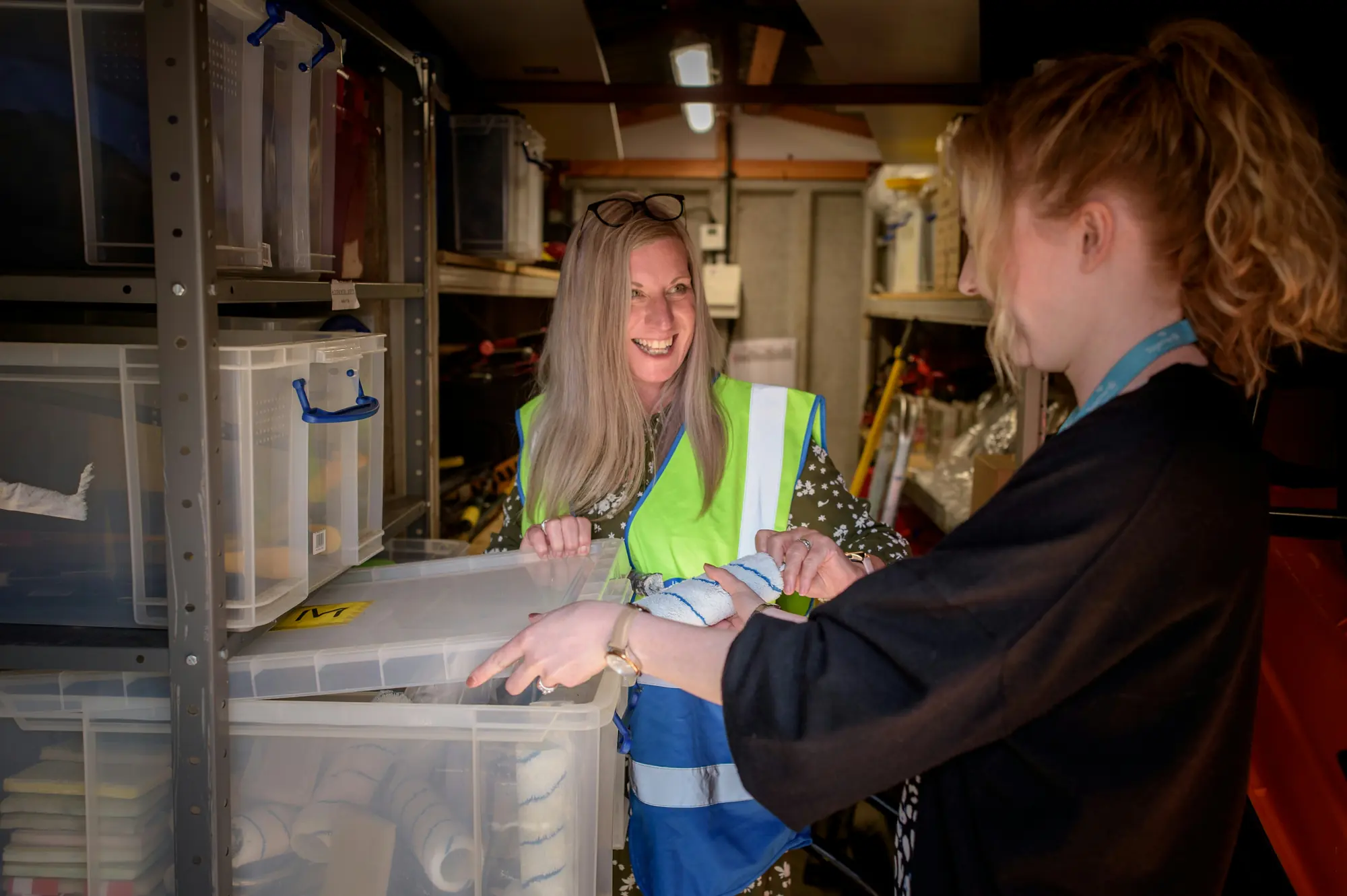 Two people checking inventory in a warehouse